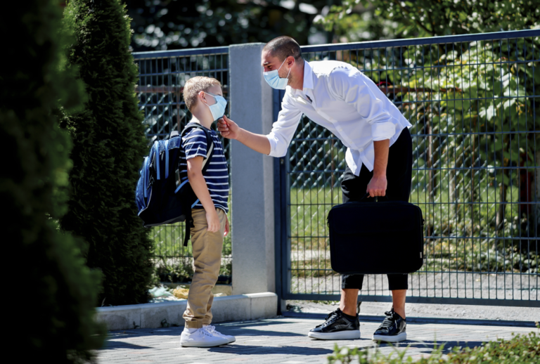 Father dropping off son at school