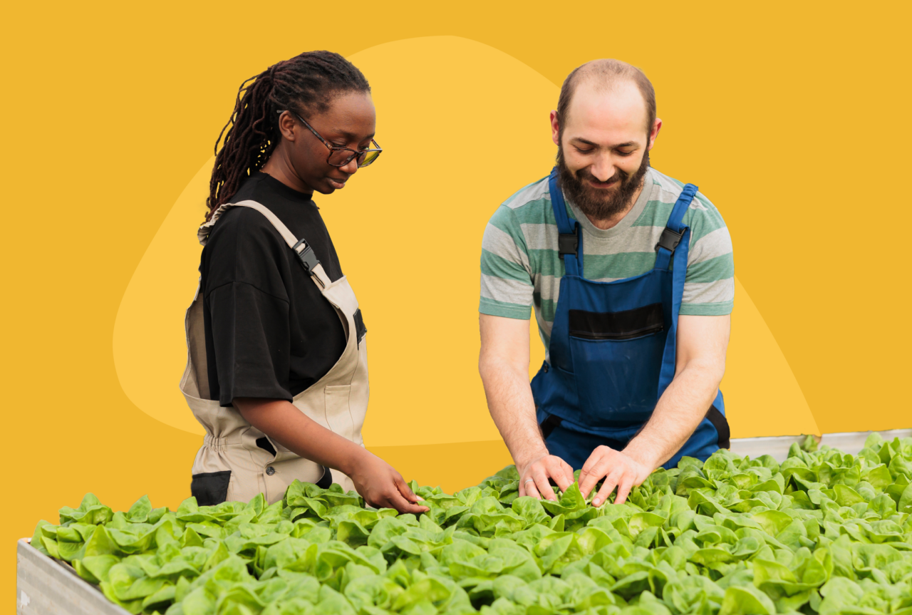 Man training woman on a work task.